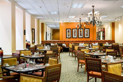 Elegant dining room setup with tables and chairs