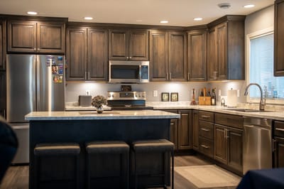 Modern kitchen interior with dark wood cabinets