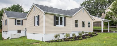 Exterior view of a light-colored assisted living facility