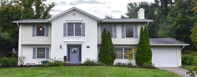Front exterior of a white multi-story building