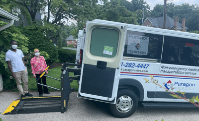 Non-emergency medical transport vehicle with staff members