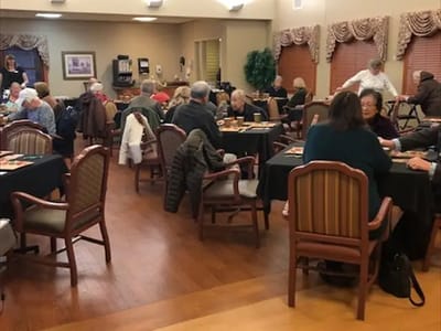 Residents engaging in a group activity in a common area