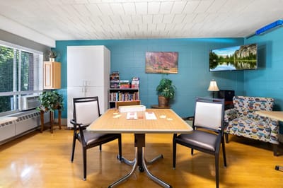 Bright activity room with seating and decorations