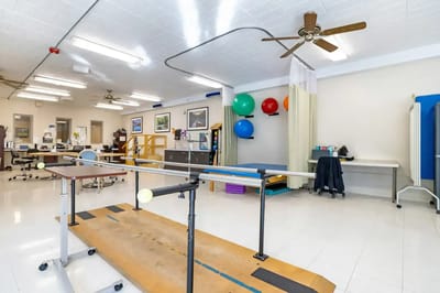 Physical therapy room with exercise equipment and therapy balls