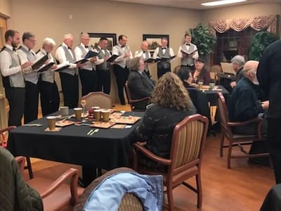 Residents enjoying a performance in a common area