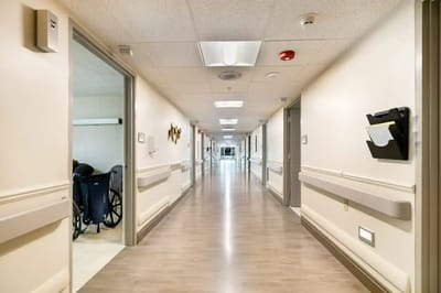 Bright, clean hallway in a nursing home facility