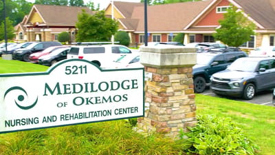 Medilodge of Okemos sign with the facility in the background