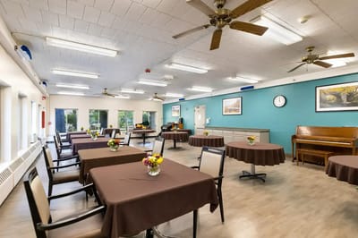 Dining room with tables set for residents