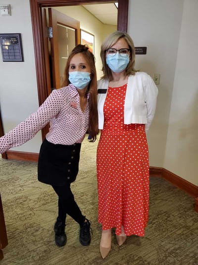 Staff members posing in a facility common area