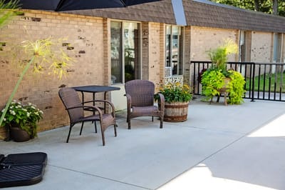 Outdoor seating area with plants and decor