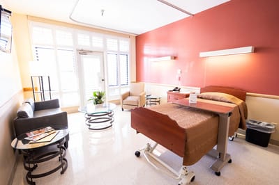 Private resident room with bed and seating area
