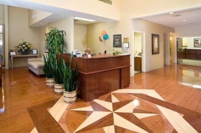 Bright reception area with a staff member at the front desk
