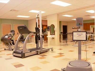 Interior view of a facility's physical therapy room with equipment