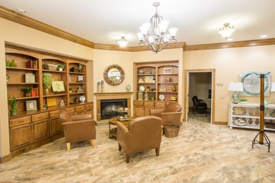 Cozy common area with seating and bookshelves