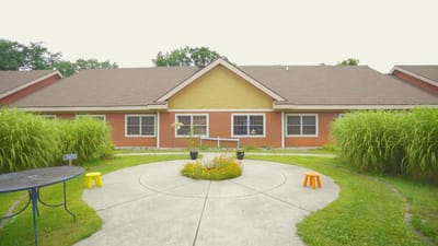 Outdoor space with garden and seating in front of the facility