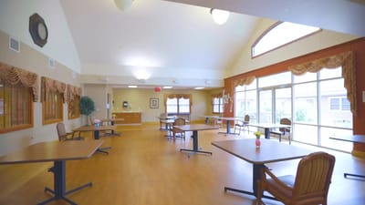 Bright common area with tables and chairs