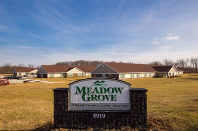 Exterior view of Meadow Grove Transitional Care Center sign