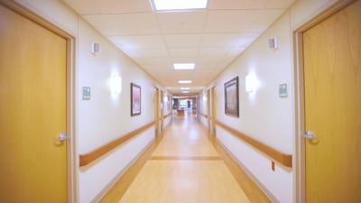 Brightly lit hallway in assisted living facility