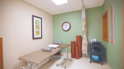 Therapy room with treatment table and equipment