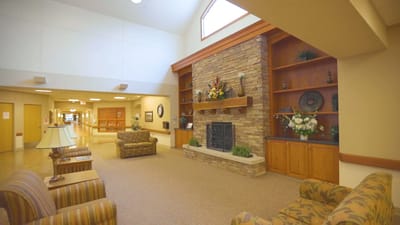 Bright interior lobby with seating and fireplace