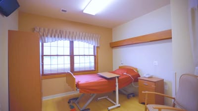 Private resident room with a bed and window