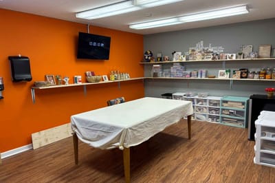 Interior common area with shelves and a table