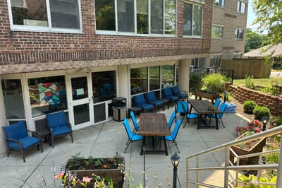 Outdoor seating area with tables and chairs