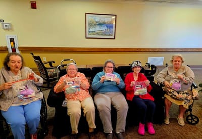 Residents participating in a craft activity together