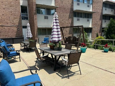 Outdoor seating area with tables and umbrellas