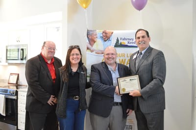 Staff presenting an award at the facility