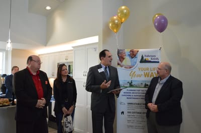 Staff members speaking at a facility event