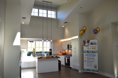 Modern kitchen area with high ceilings and balloons
