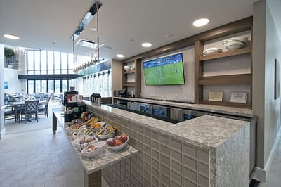 Bright dining area with snacks and a television