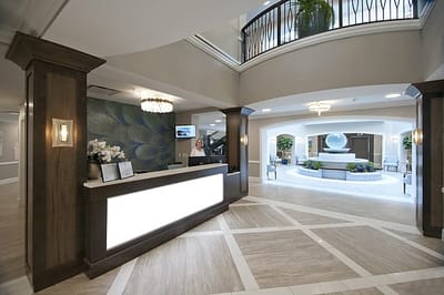 Spacious lobby area with reception desk and fountain