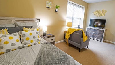 Cozy resident room with bed and seating area