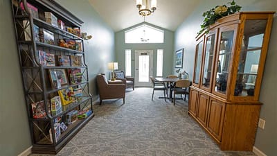 Bright common area with seating and bookshelves