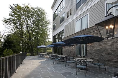 Outdoor patio area with seating and umbrellas