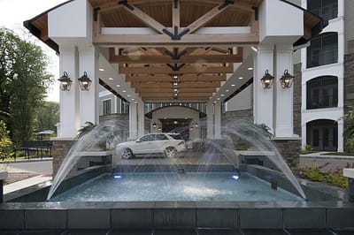 Exterior view of the facility entrance with fountain