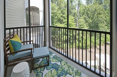 Cozy balcony area with greenery views