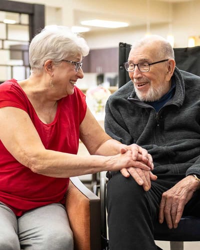 Residents enjoying a conversation in a social space