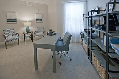 Cozy common area with a desk and seating