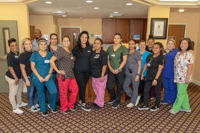 Staff members posing in the facility's common area