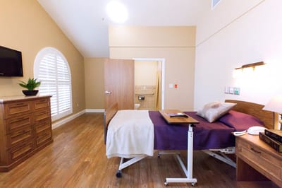 Private resident room with bed and dresser