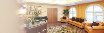 Interior lounge area with piano and seating
