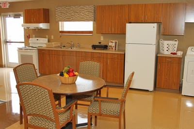 Altercare Majora Lane, Nursing Home in Millersburg, OH — Bright communal kitchen with a dining table and fruit bowl