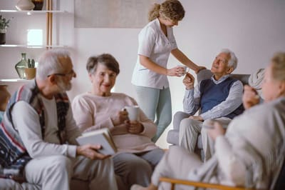 Residents enjoying conversation in a cozy common area