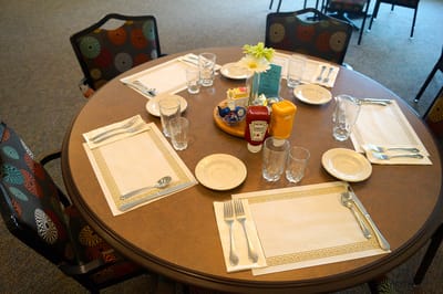 Dining table set with plates and condiments