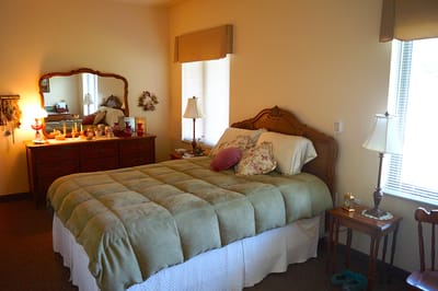 Cozy private resident room with bed and dresser