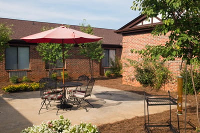 Outdoor seating area with table and umbrella