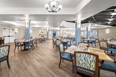 Bright dining room with tables set for meals